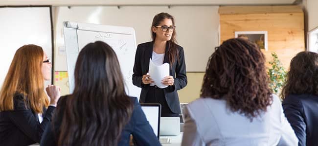 Talent management Coders Lab Woman teacher in class with students