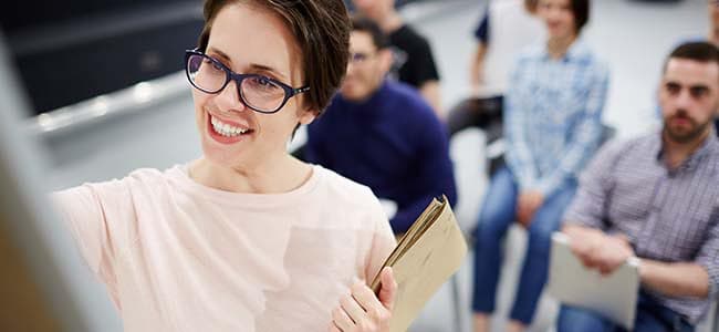 Outplacement Coders Lab A happy teacher with students