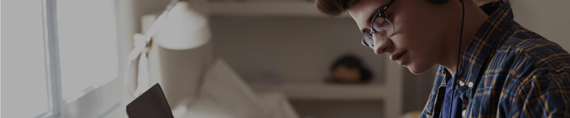 Graduates story image Young man with glasses with a laptop