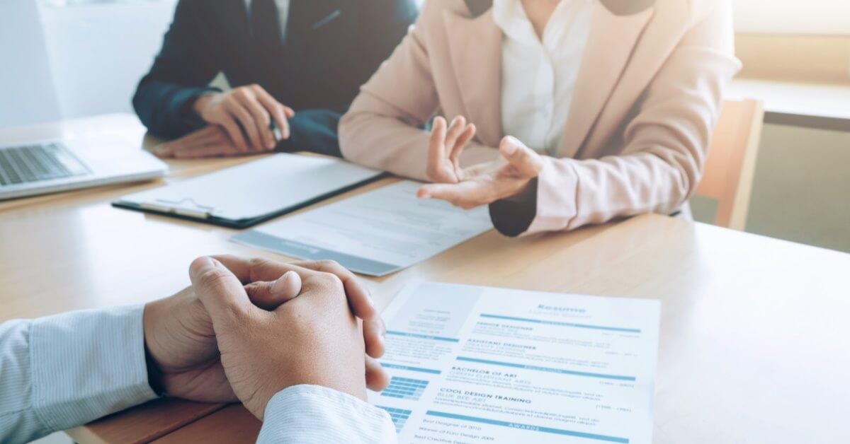 Coders Lab partners with Inplay Recruit View of hand gestures during a meeting conversation.